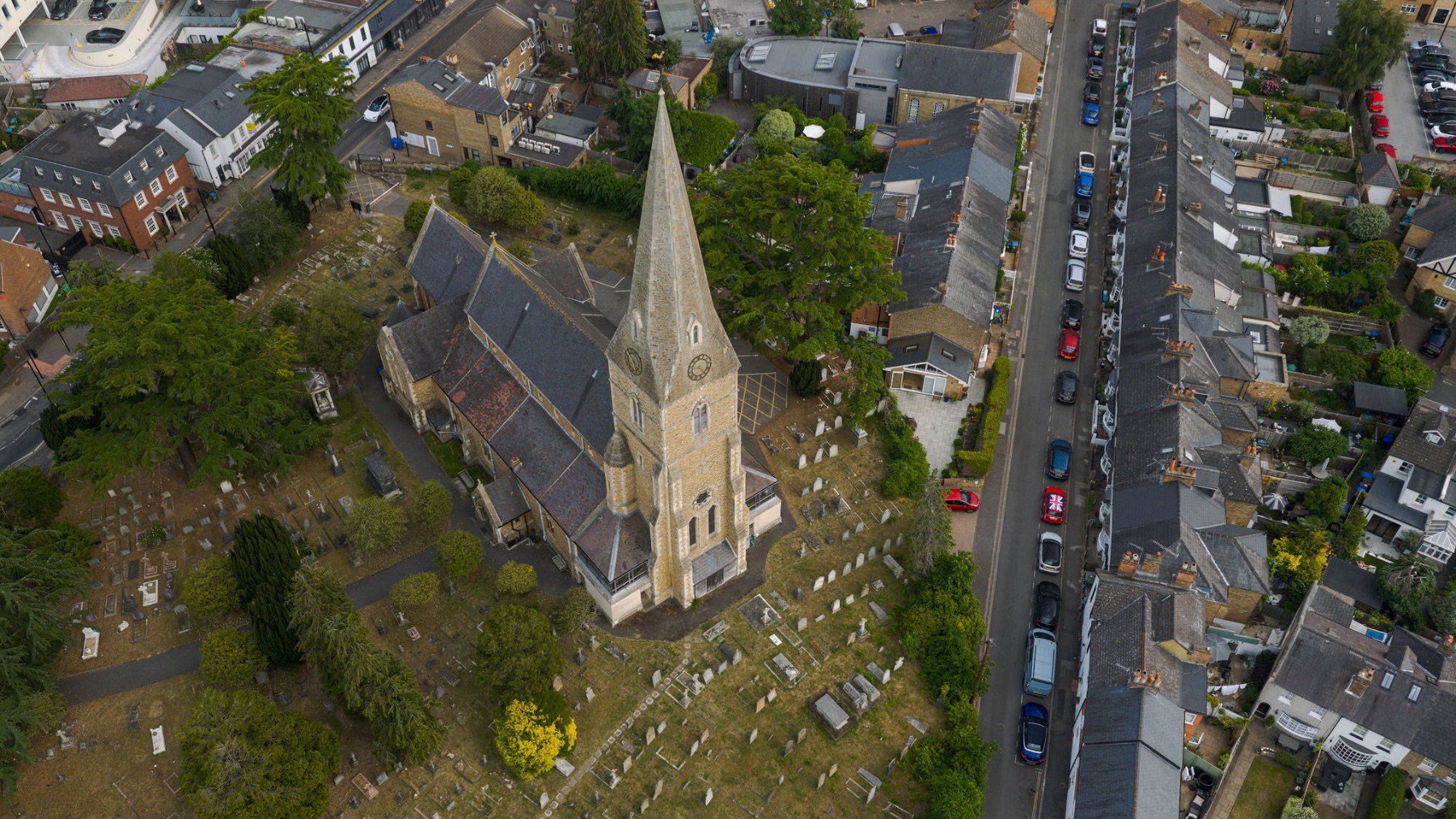 Aerial view over Esher with the church spire and leafy commons