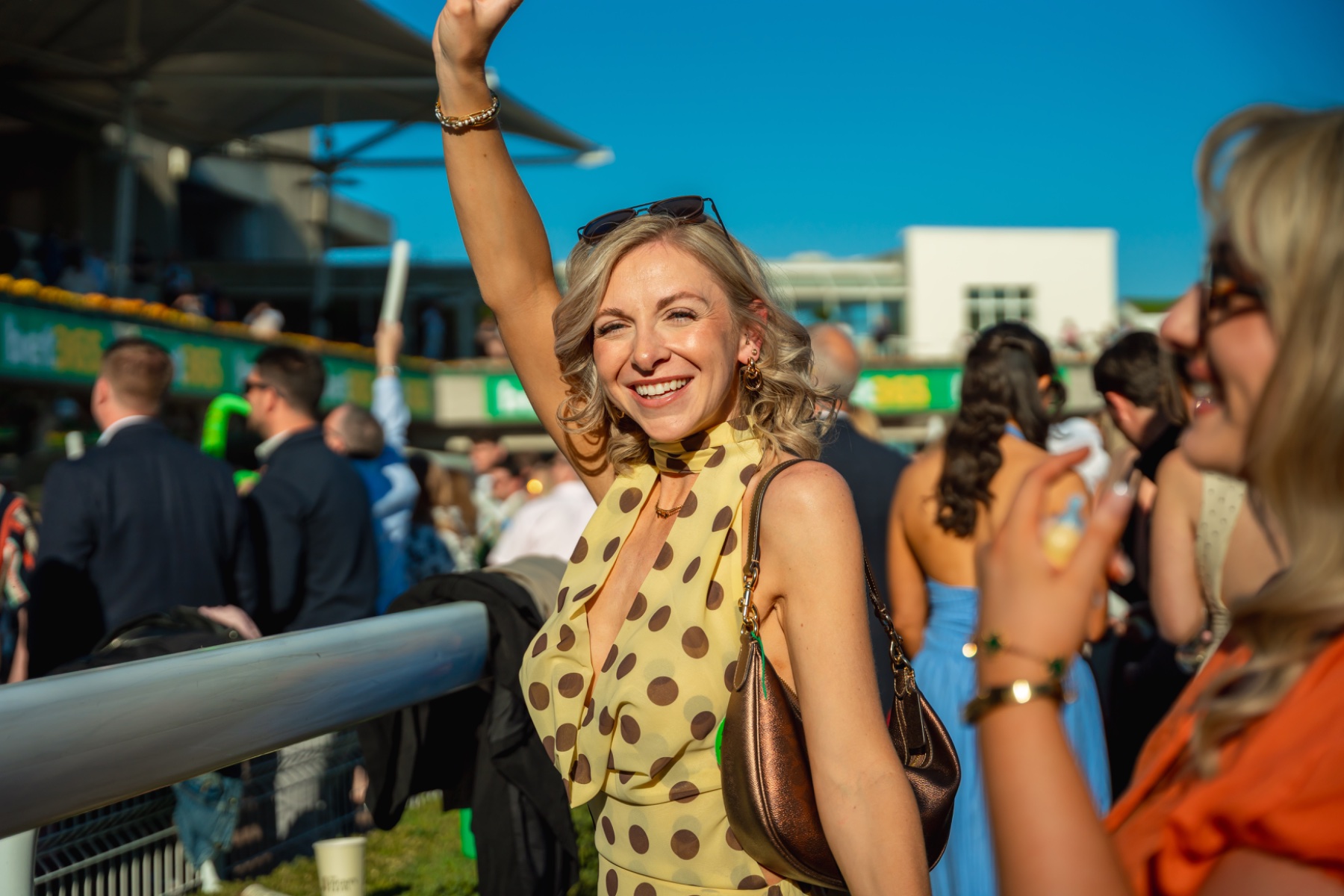 A racegoer celebrating at Sandown Park