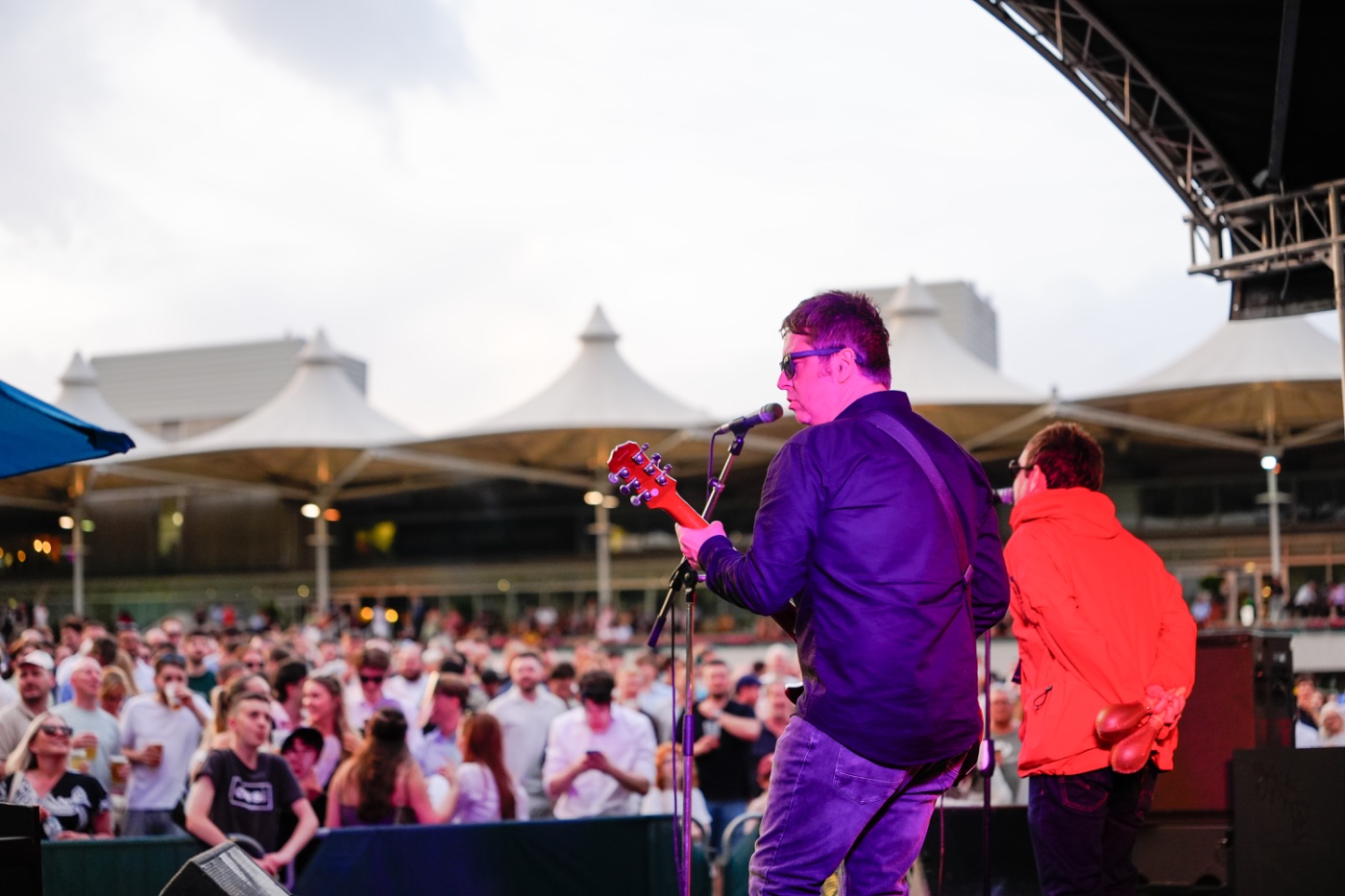 A racegoer celebrating at Sandown Park's music night